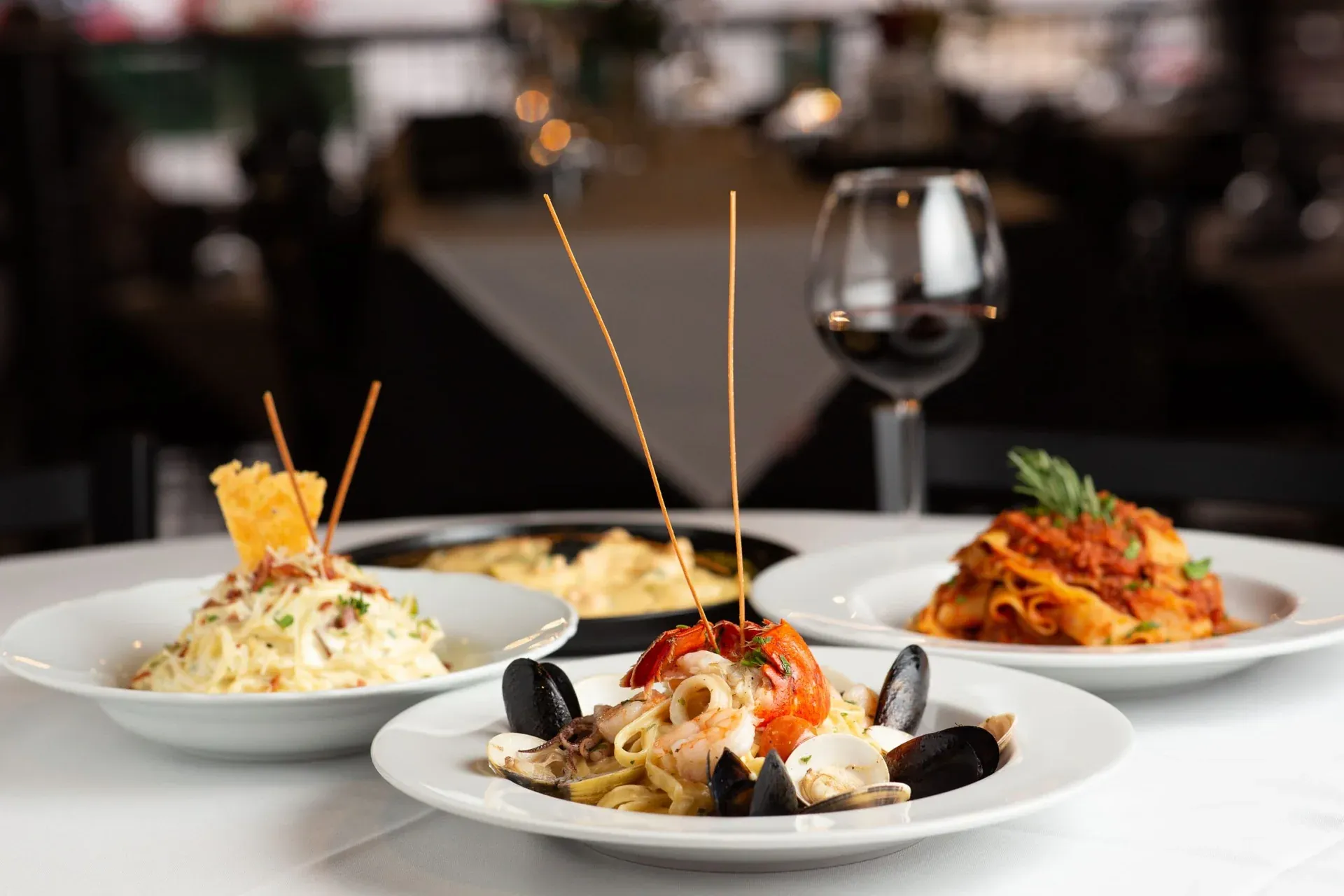 An assortment of Italian dishes prepared by Carmine’s
